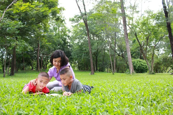 Three asian kids having a good time in the park