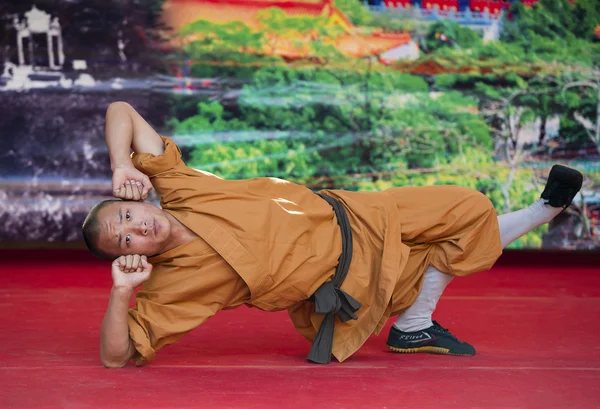 Shaolin monks does no-charge street show to promote chinese martial arts.