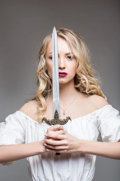 Blond long haired girl with sword
