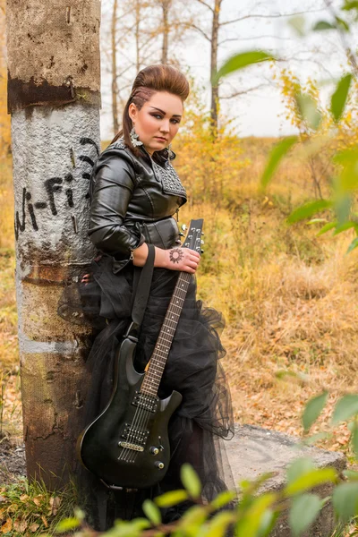 Rock woman with guitar
