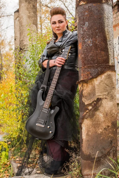 Rock woman with guitar