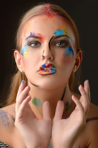 Beautiful woman with art make-up