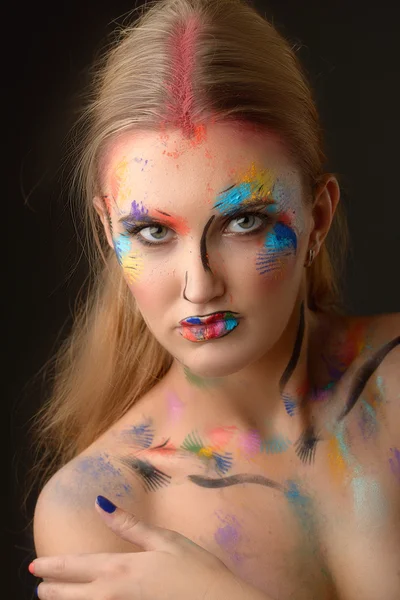 Beautiful woman with art make-up