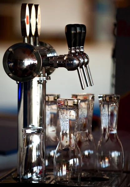 Beer taps and glasses at the bar