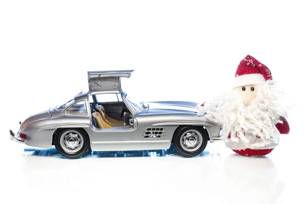 Santa Claus or Father Frost with old retro car