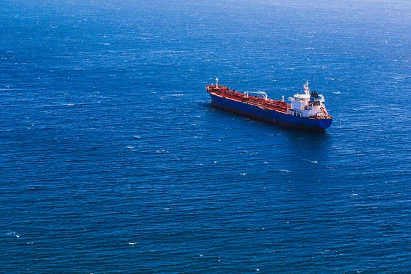 Container cargo ship in blue ocean