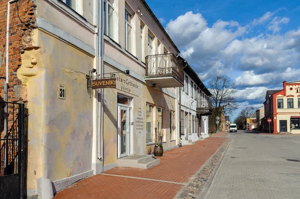 Street of old town of Bauska town with old houses and small souvenir shops