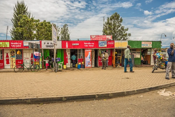 Shopping street scene with pedestrians in Naivasha, Kenya