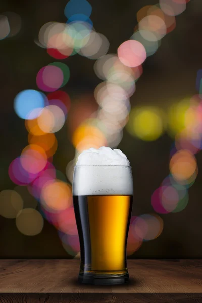 Glass of beer with bar scene