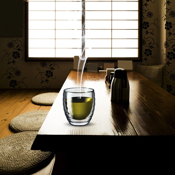 Glass of Green Tea on wood table