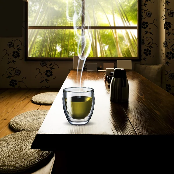 Glass of Green Tea on wood table