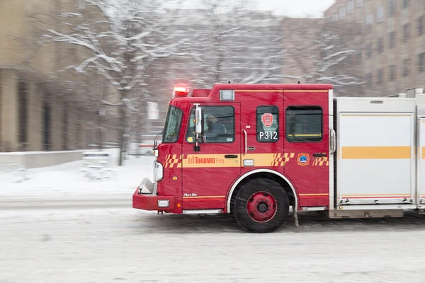 Toronto Fire Truck Moving down a Road