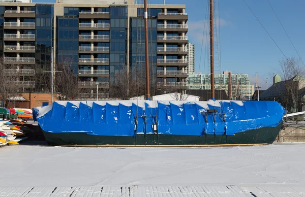 Boat Covered in Plastic to protect it in the Winter