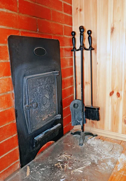 Set of cast iron objects near the stove in the Russian bath