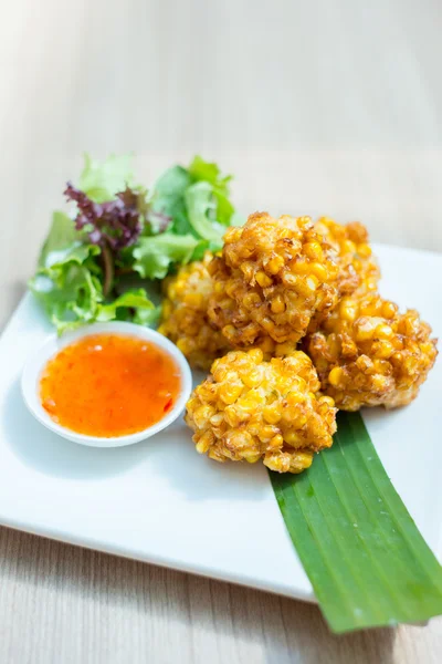 Deep fried corn balls with salad