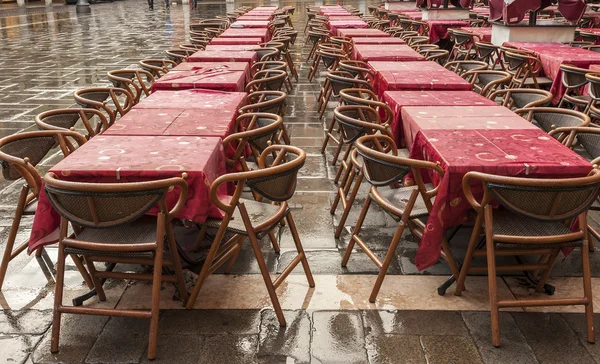 Wet cafe tables in Italian Piazza