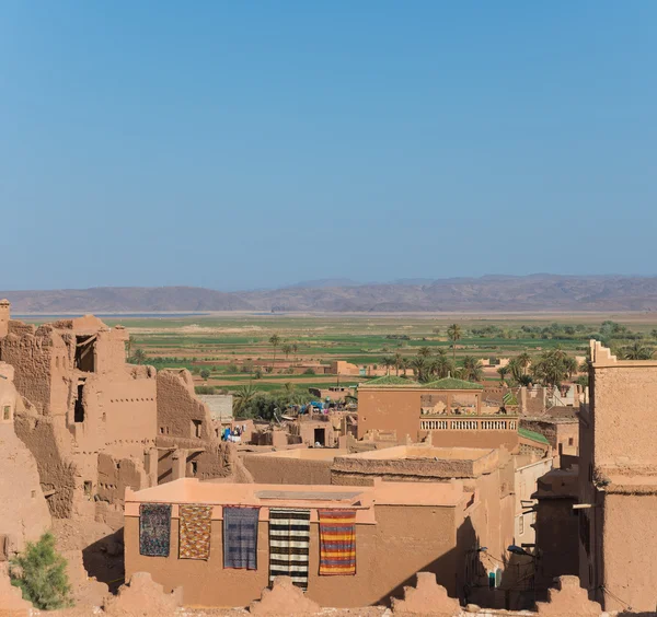 The traditional house in Arabian style with blue sky and green f