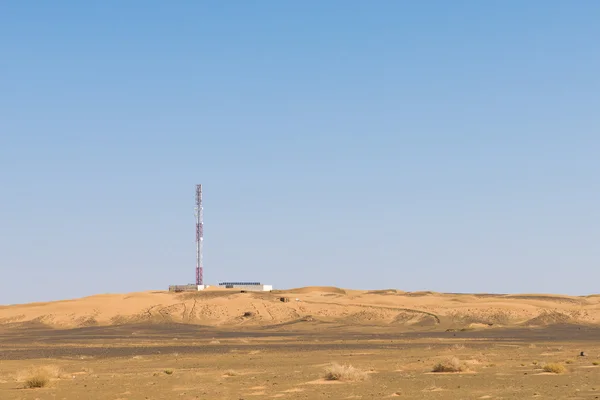 The telecommunication station in the desert with solar cell
