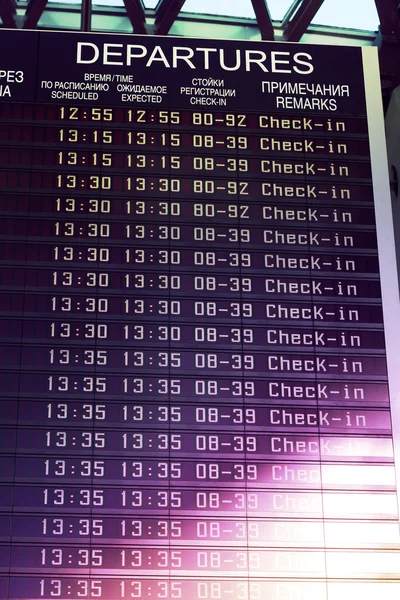 Image of flights information board in airport terminal