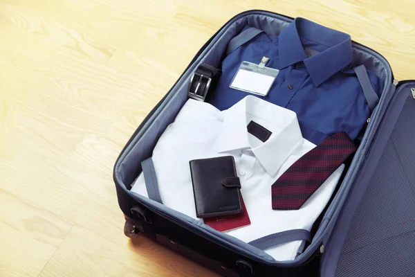 Image of businessman's clothes in travel bag
