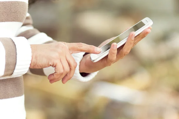 Touch phone in the hands of women