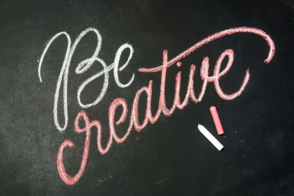 Quote - Be creative on black chalkboard handwritten by color chalks