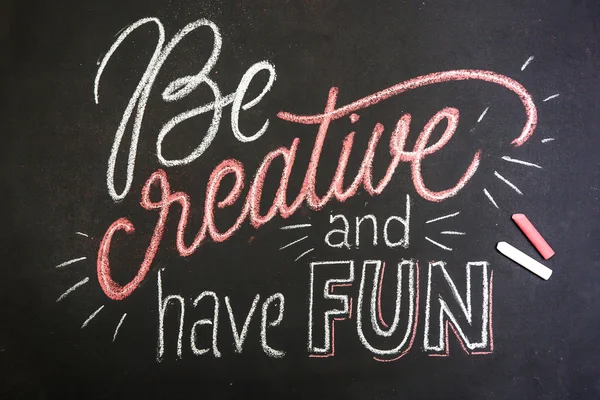 Quote - Be creative and have fun- on black chalkboard handwritten by color chalks