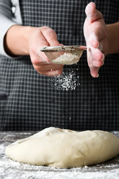 Woman making bread with her hands