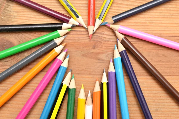 Colored pencils on wood with heart form