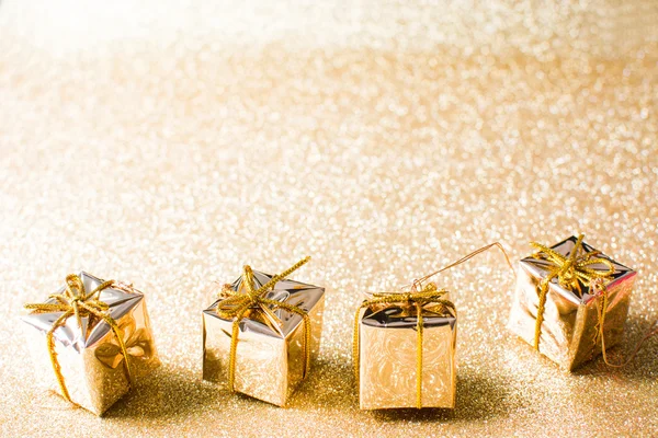 Golden gift boxes with golden glitter background