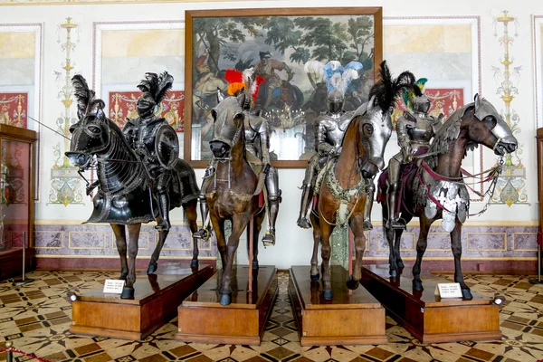 Medieval knights on horses in the knights \' hall in the State He