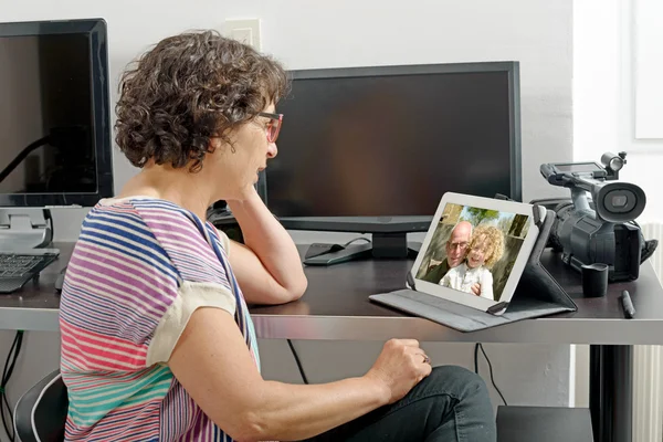 Mom making a distant call on internet