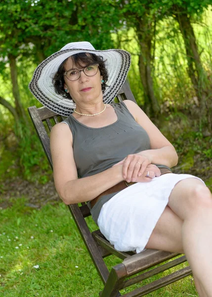 Beautiful woman relaxing in the garden