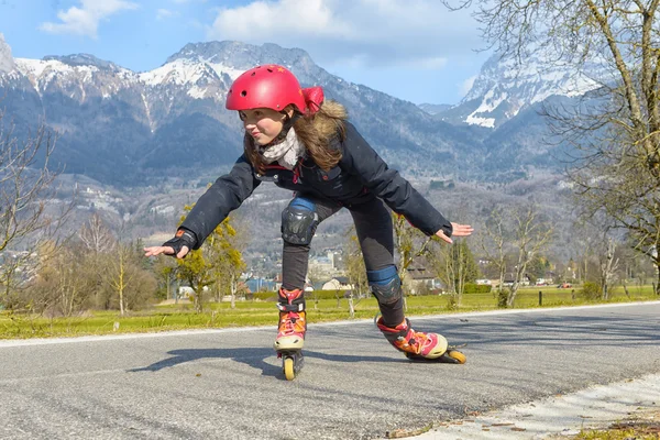 Pretty preteen girl on roller skates