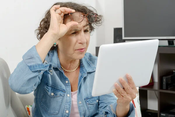 A middle-aged woman with eyes pain