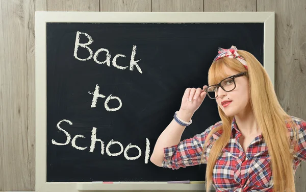 Back to school, pretty teacher with black glasses