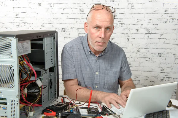 A technician repairing a computer