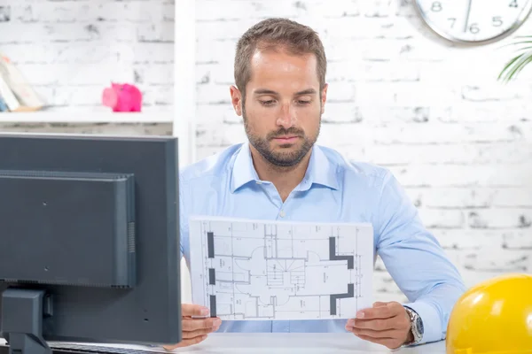 Young engineer working on his computer