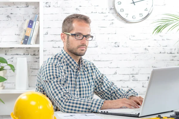 Young executive working with his computer