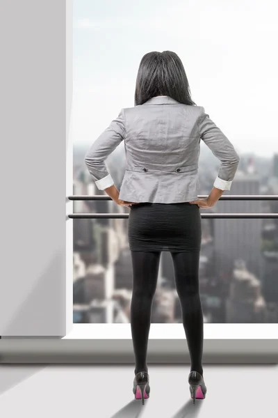 African american businesswoman smiling, on white, back view