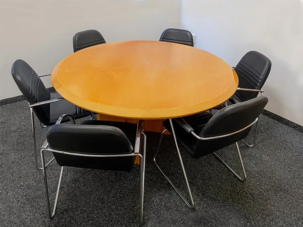 Meeting table and black chairs