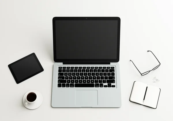 Laptop, tablet, book and coffee cup