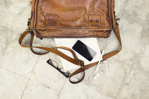 Brown leather handbag, cell phone, diary and glasses