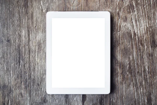 Blank digital tablet on a wooden table, mock up