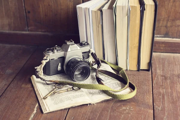 Pack of old books with old  camera