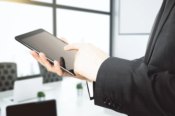 Man working with digital tablet, close up