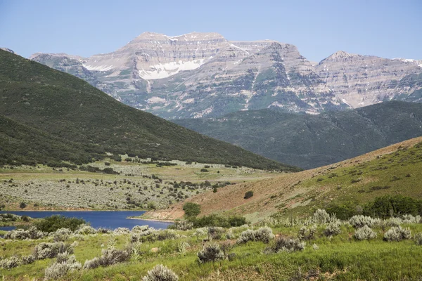 Beautiful scenic Utah mountain lake spring landscape with snow