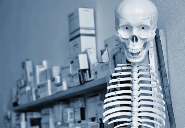 Skeleton with pills in the background. Suitable background for the medical and healthcare fields. Health promotion and healthy lifestyles.
