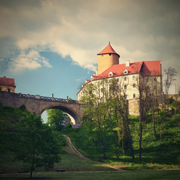 Beautiful Gothic castle Veveri. The city of Brno at the Brno dam. South Moravia - Czech Republic - Central Europe. Spring landscape.
