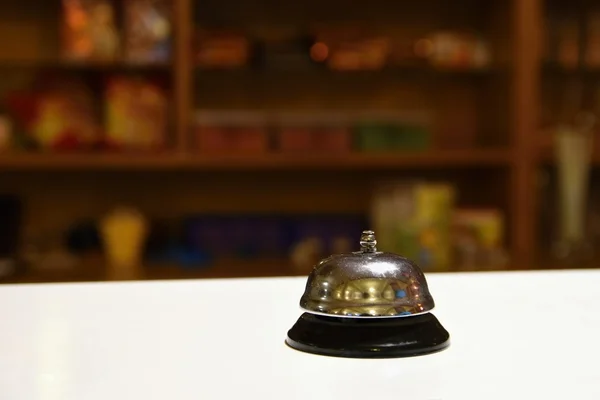 Receptionist bell. Blurred background reception or restaurant.